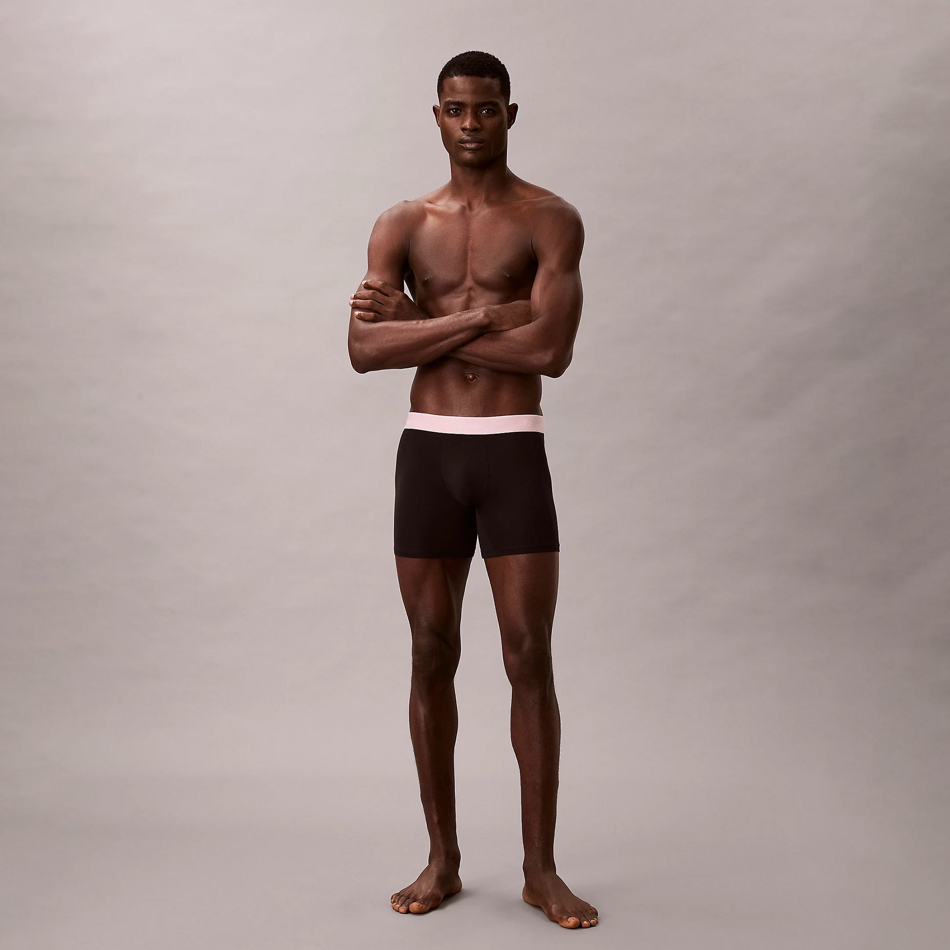 Calvin Klein BOXER BRIEF 3 Pack Mens Cotton Stretch Black front view model standing with arms crossed.