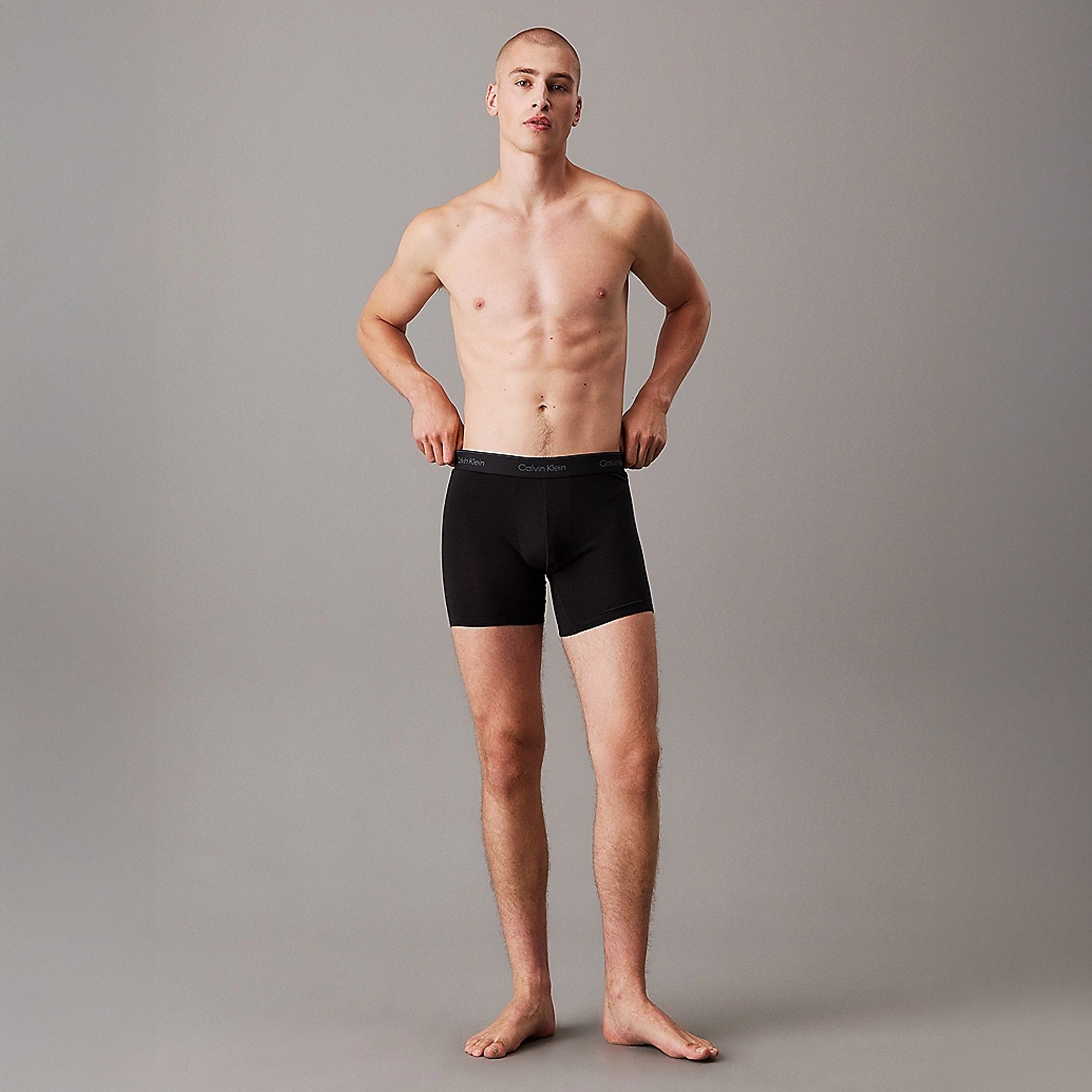 Calvin Klein ICON COTTON STRETCH 3 Pack Mens Boxer Briefs Black/Glacier/Blue front view on model with medium rise waist.