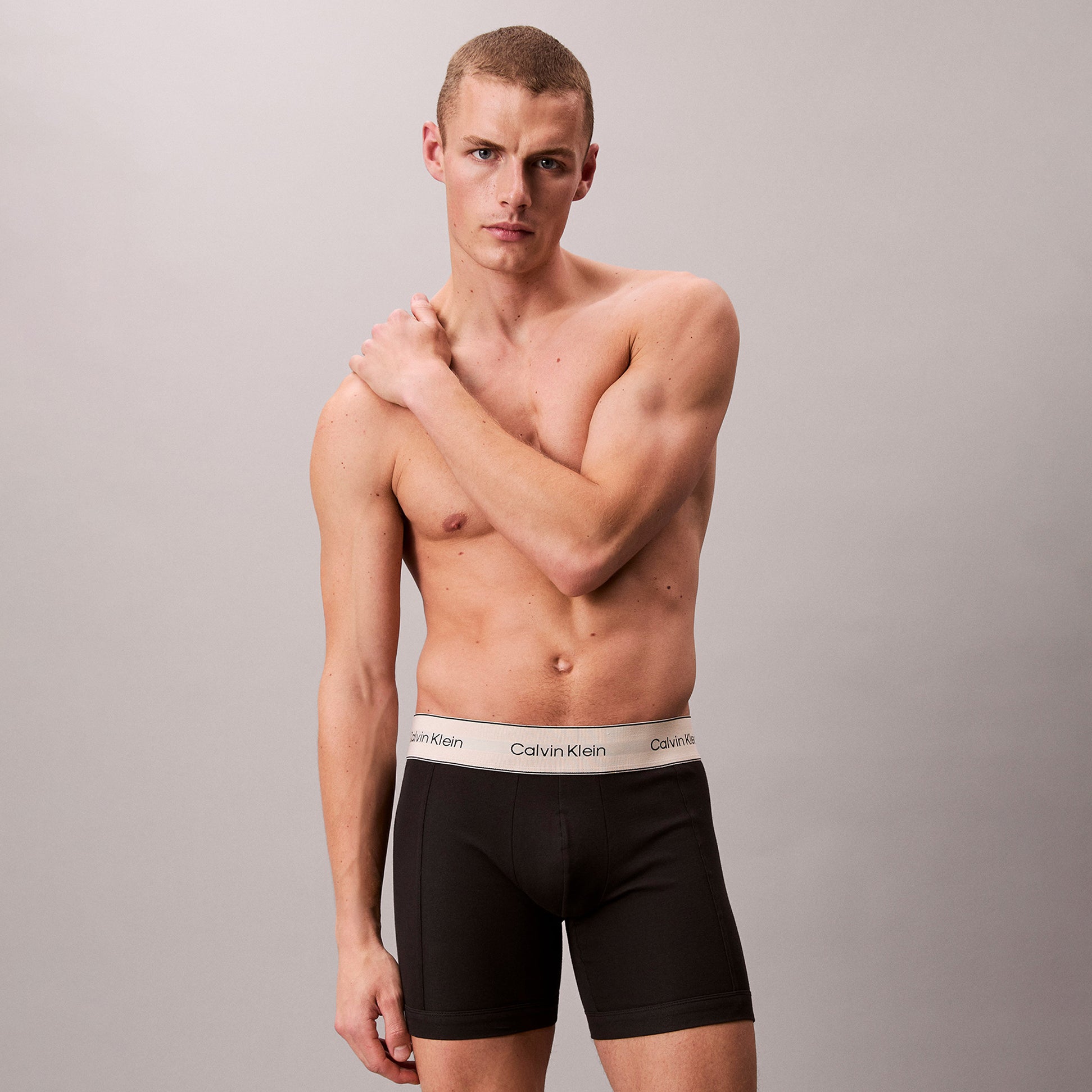 Calvin Klein BOXER BRIEF 3 Pack Mens Cotton Stretch Black side view on model, showcasing fit and style.
