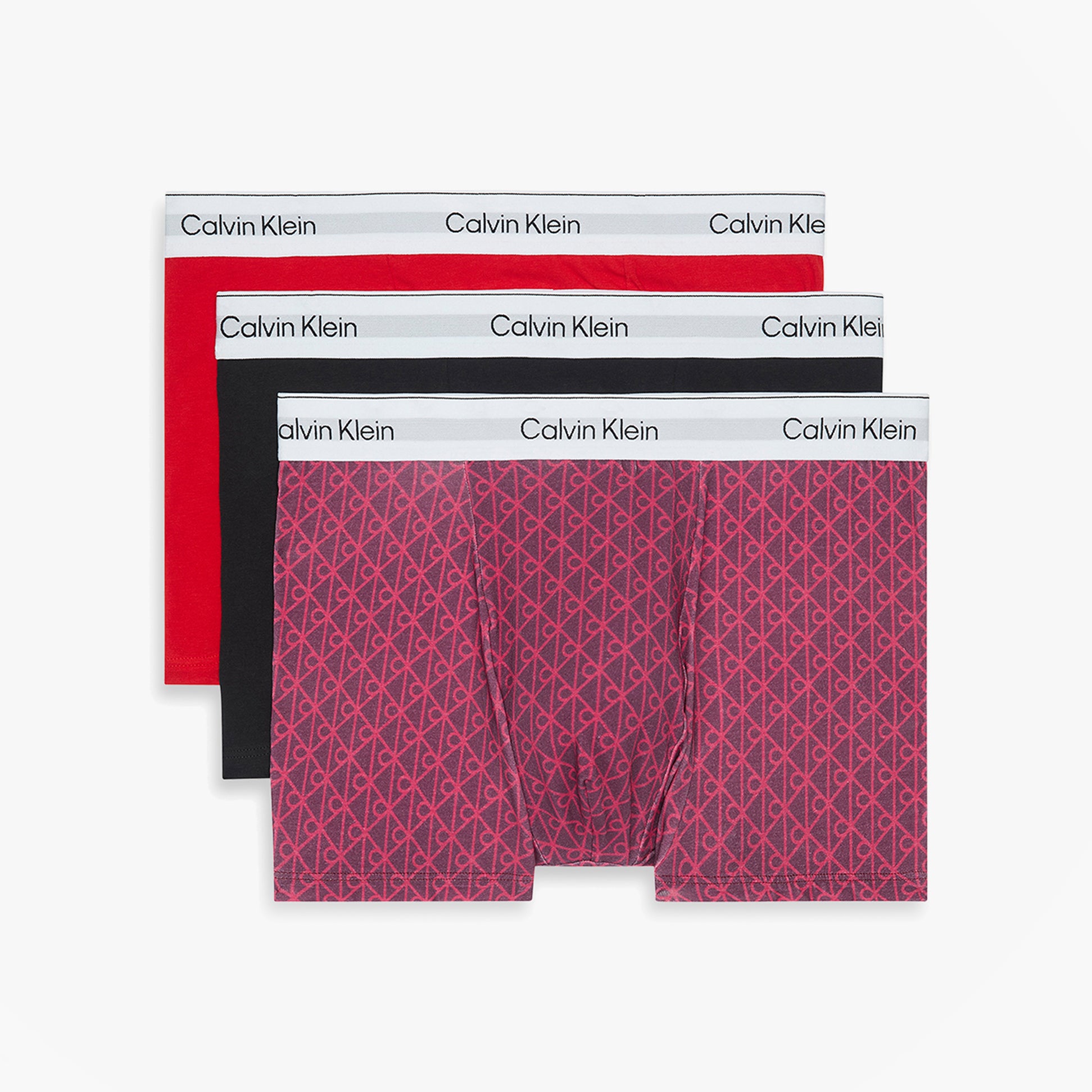 Calvin Klein RELAXED FIT 3 Pack Mens Trunks Multicoloured front view showing red, black, and patterned trunks.