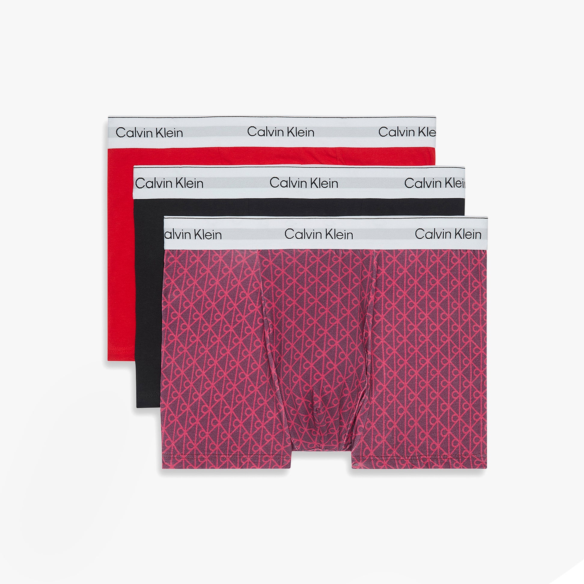 Calvin Klein RELAXED FIT 3 Pack Mens Trunks Multicoloured front view showing black, red, and patterned trunks with logo waistbands.