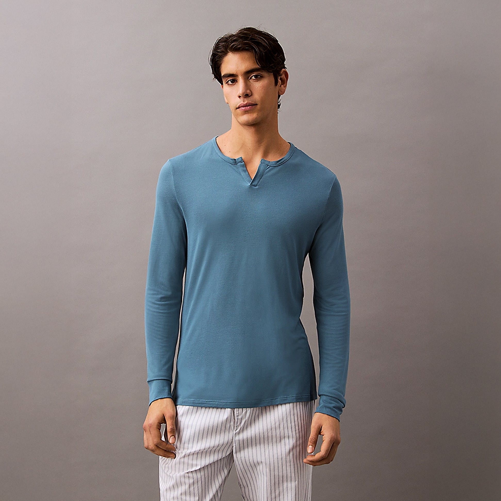 Calvin Klein ULTRA SOFT MODAL Mens Pyjama Top Deck Gray front view model wearing long-sleeve shirt with Henley neckline.