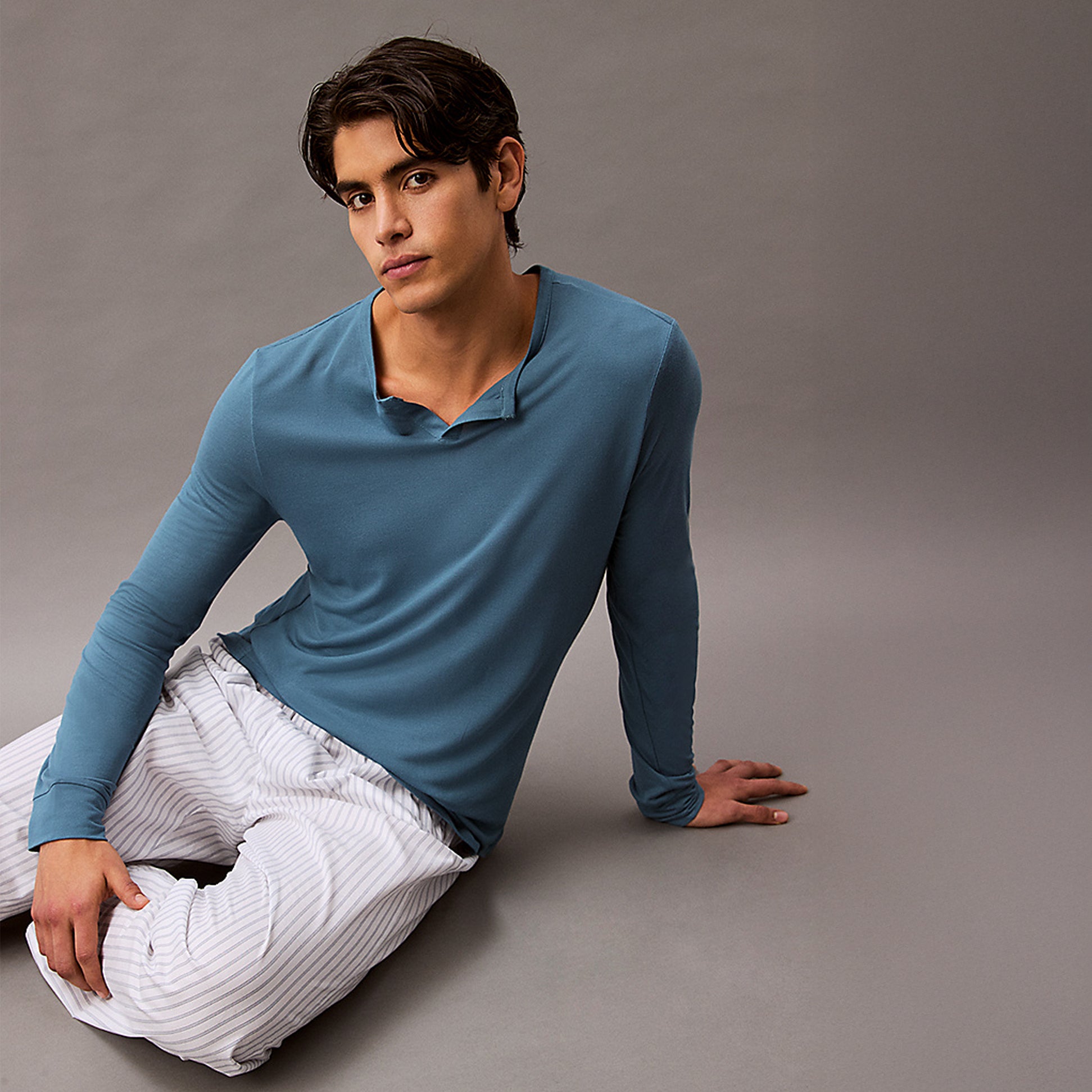 Calvin Klein ULTRA SOFT MODAL Mens Pyjama Top Deck Gray front view on model, featuring long sleeves and henley neckline.