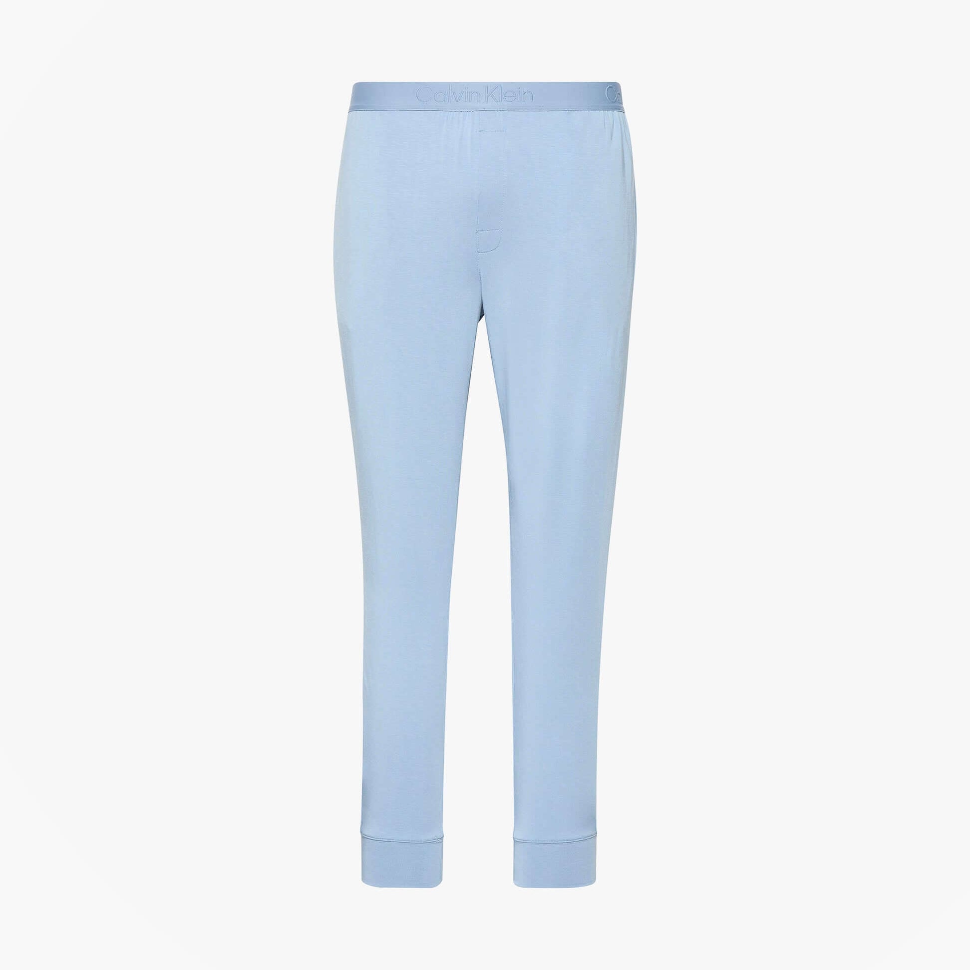 Calvin Klein ULTRA SOFT MODAL Mens Lounge Joggers Faded Denim front view, featuring cuffed tapered legs and tonal elastic waistband.