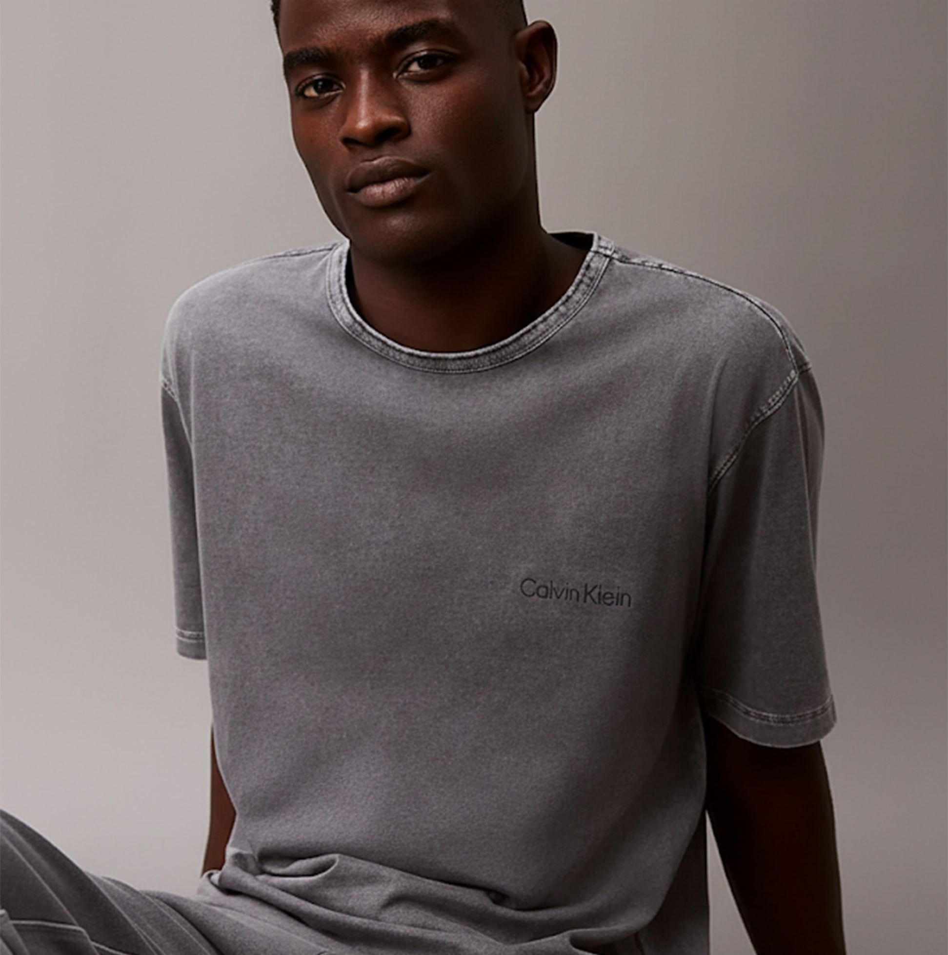 Calvin Klein 100% COTTON Mens Lounge T-Shirt Forged Iron front view on model, featuring crew neckline and patch pocket.