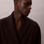 Calvin Klein QUILTED ROBE Mens Bathrobes Black side view of model wearing robe, showcasing the fabric and style.