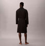 Calvin Klein QUILTED ROBE Mens Bathrobes Black back view on model, showcasing long sleeve and regular fit.