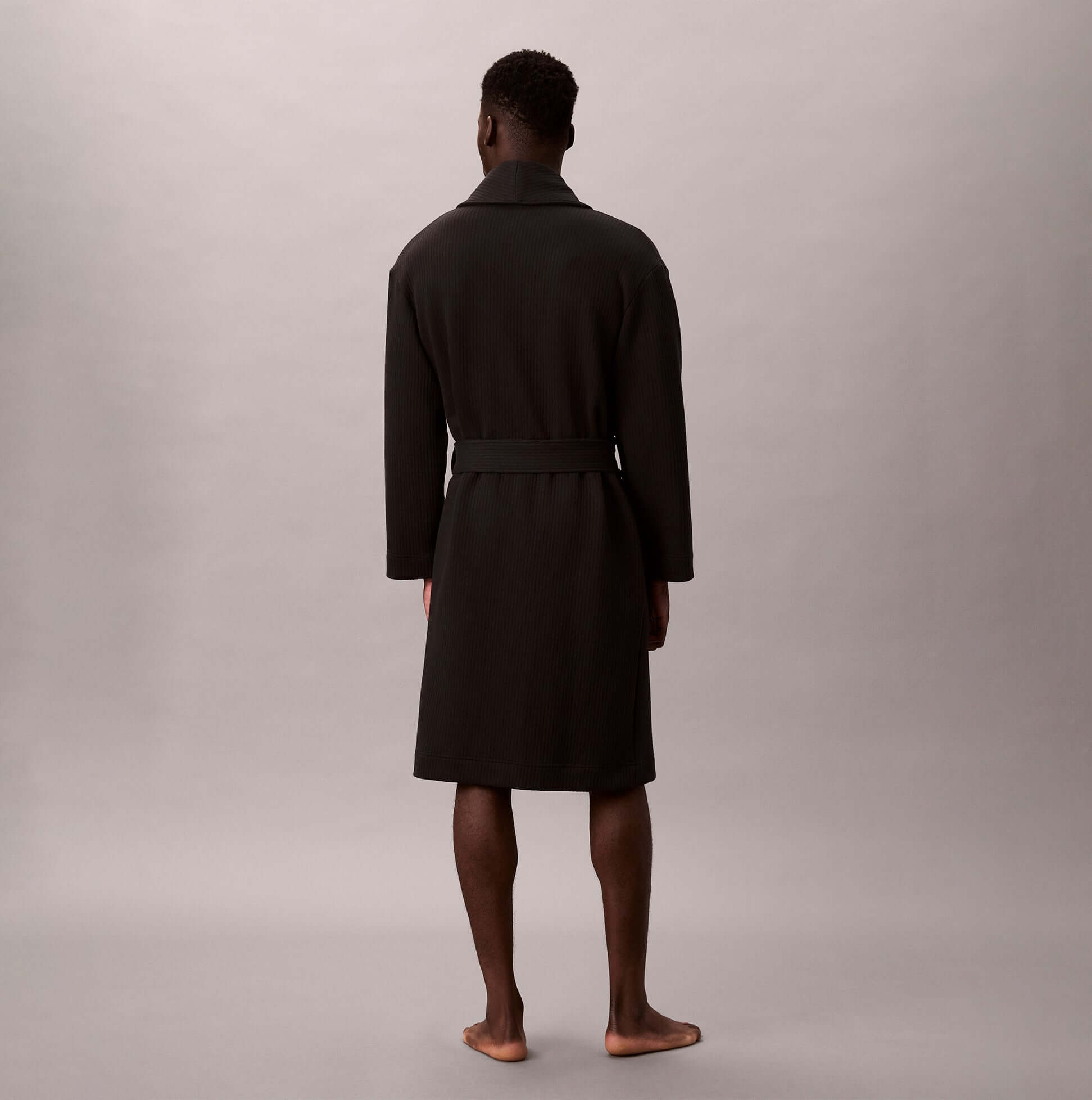 Calvin Klein QUILTED ROBE Mens Bathrobes Black back view on model, showcasing long sleeve and regular fit.
