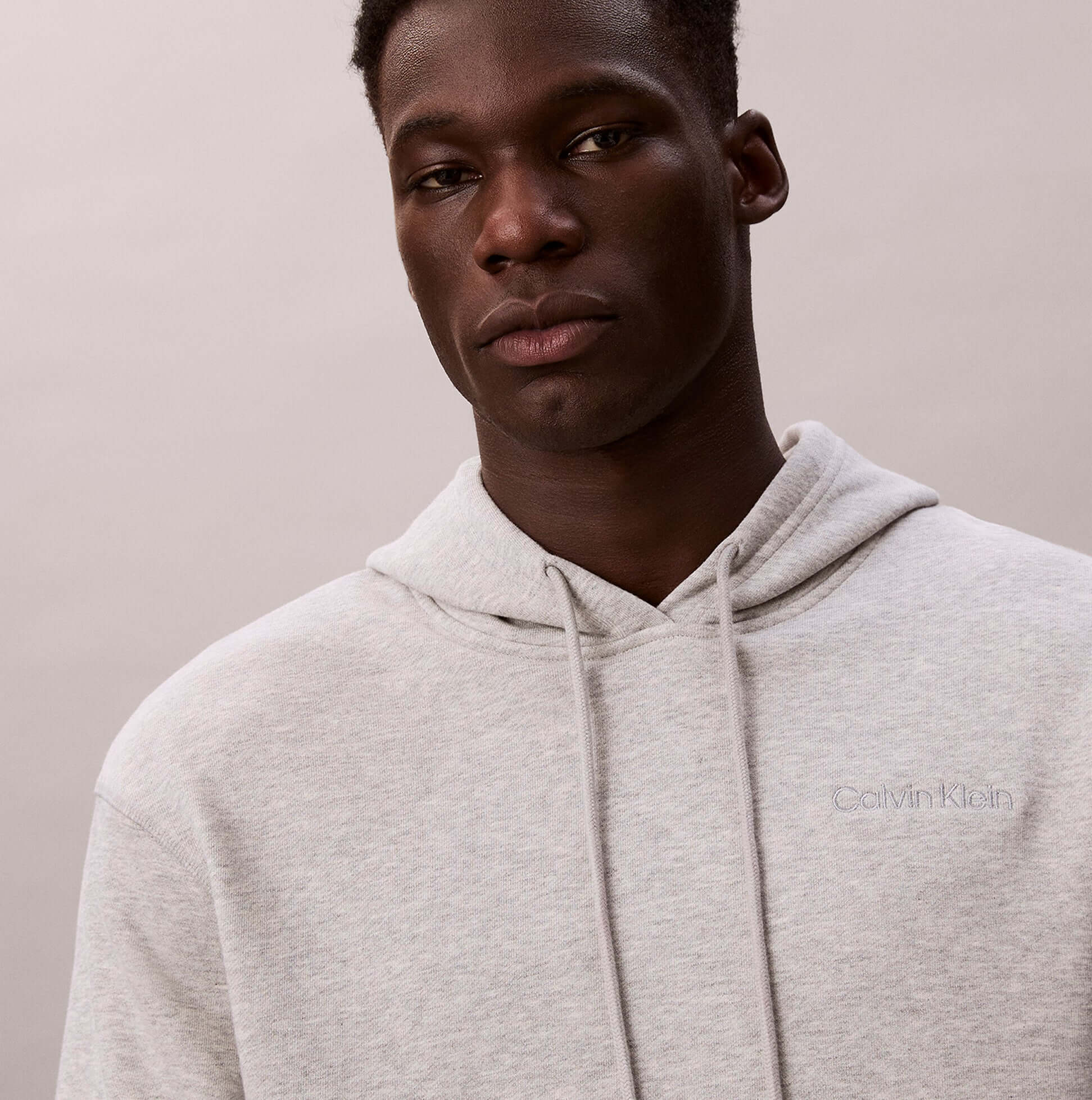 Calvin Klein L/S HOODIE Mens Hoodie Grey Heather close-up view showcasing soft fabric and logo detail.