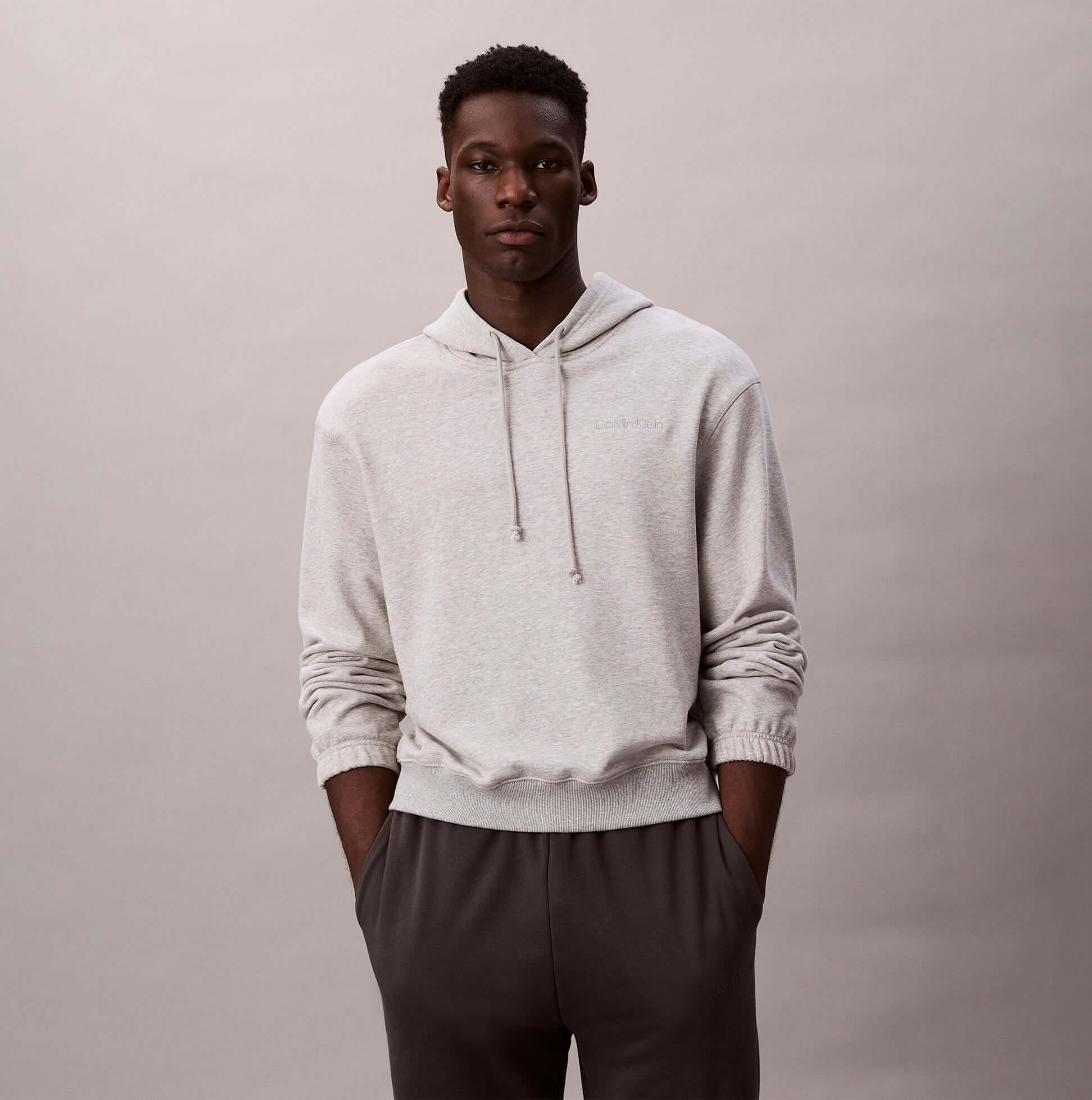 Calvin Klein L/S HOODIE Mens Hoodie Grey Heather front view, relaxed fit, made of 85% cotton, 15% polyester.