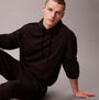 Calvin Klein L/S HOODIE Mens Hoodie Black, front view, model seated wearing black hoodie, relaxed fit.