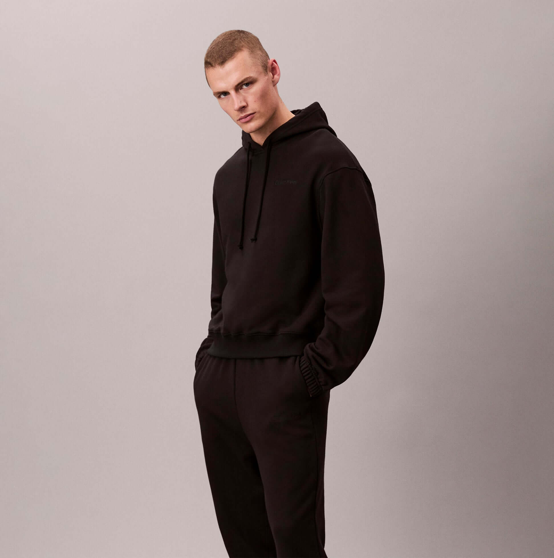 Calvin Klein JOGGER Mens Black front view model wearing black joggers and hoodie.