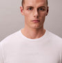 Calvin Klein LS TEE PANT SET Mens Multicoloured front view close-up of model wearing white t-shirt.