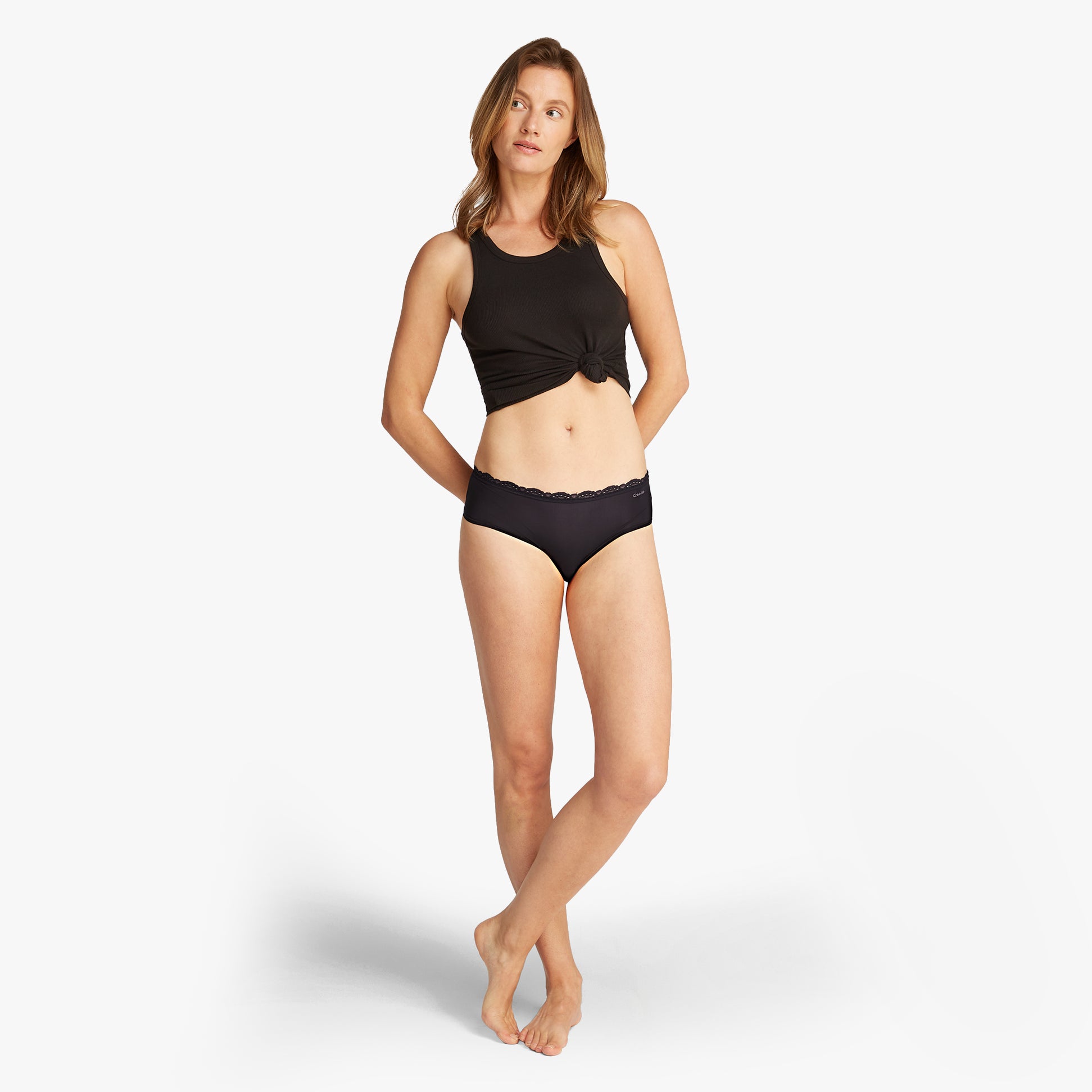 Calvin Klein MICRO STRETCH 3 Pack Womens Hipster Briefs Black side view on model wearing black top and briefs.