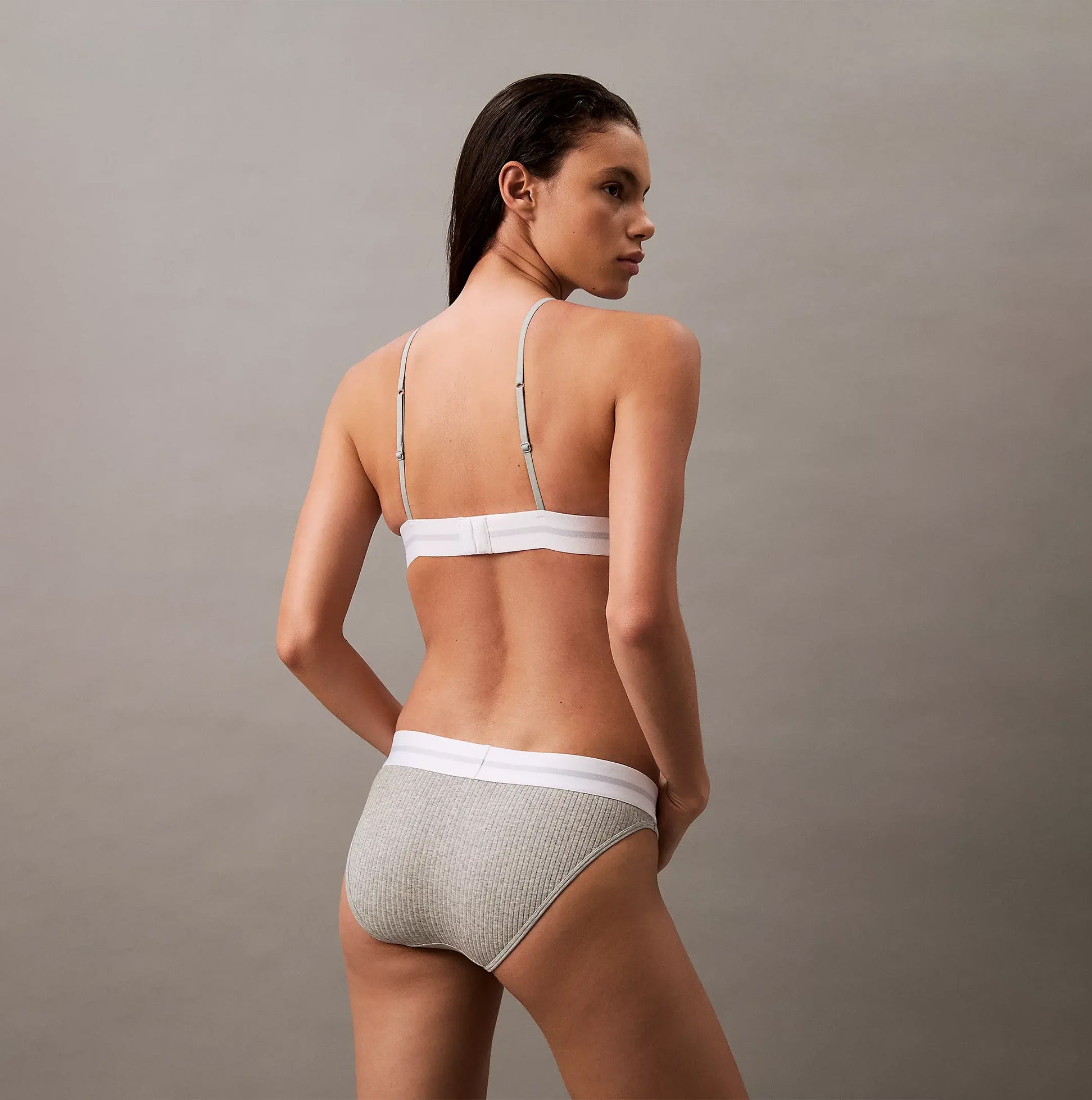 Calvin Klein BIKINI Brief Womens Cotton Modal Stretch Rib Grey rear view on model showcasing soft fabric and comfortable fit.