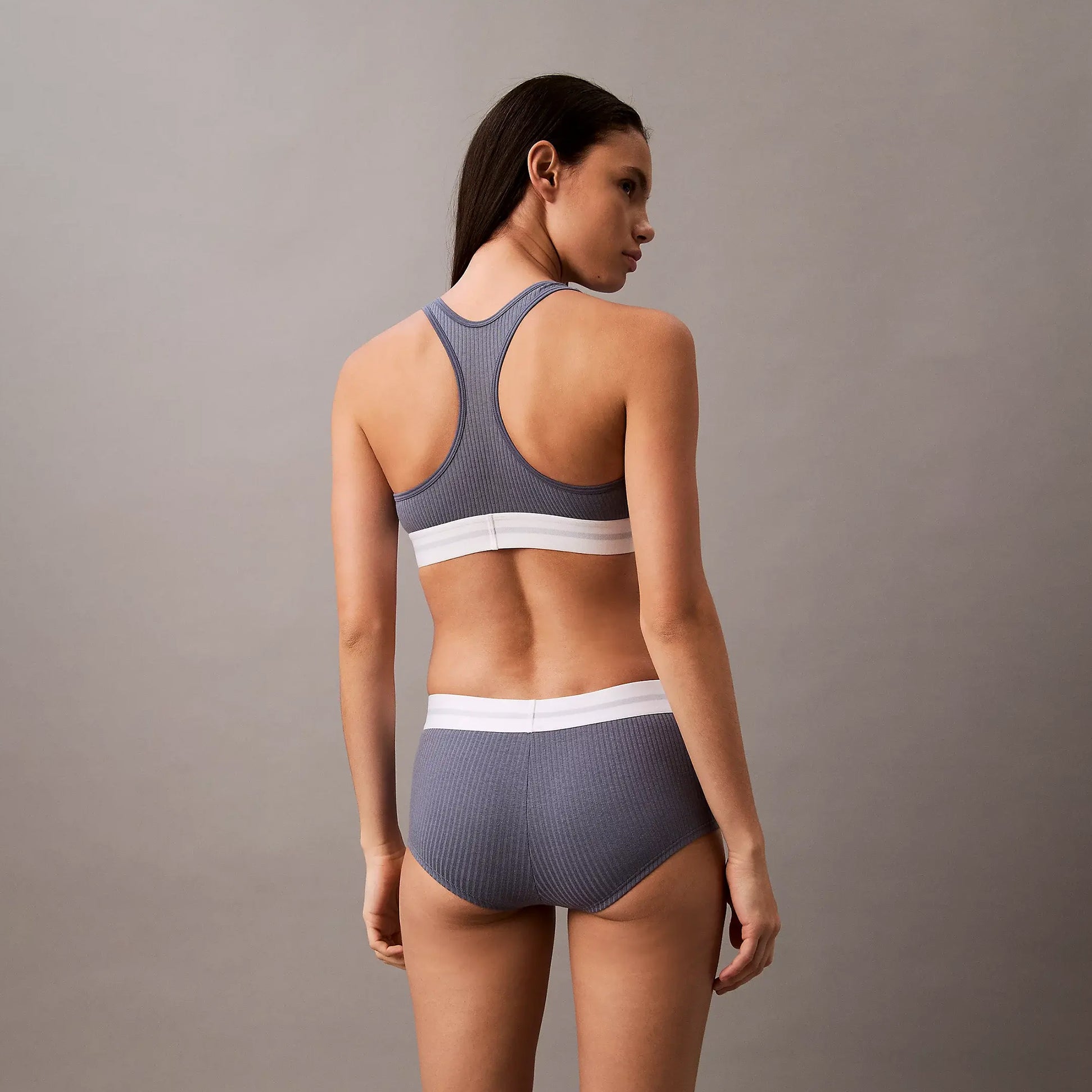 Calvin Klein Womens Hipster Panty BOYSHORTS Grey back view on model with matching sports bra.