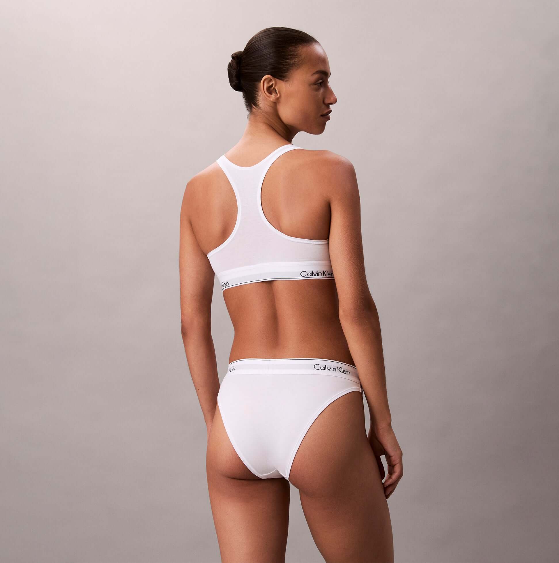 Calvin Klein Icon Cotton Modal Womens Unlined Bralette White back view on model wearing matching panties.