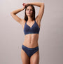 Calvin Klein Icon Cotton Modal Womens Thong Denim side view on model wearing matching bra