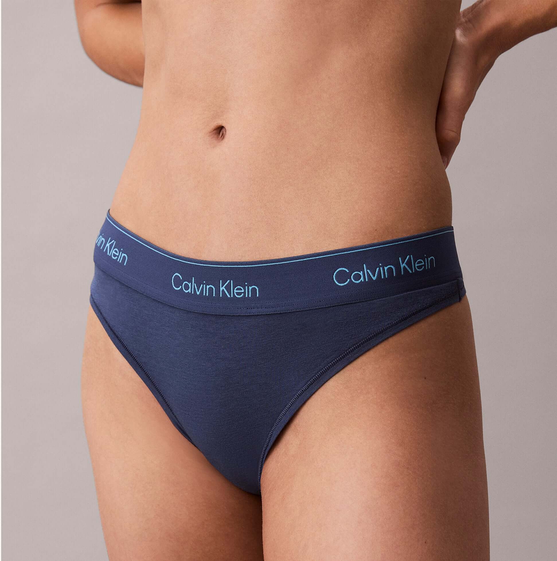 Calvin Klein Icon Cotton Modal Womens Thong Denim side view showcasing the soft fabric and logo waistband.