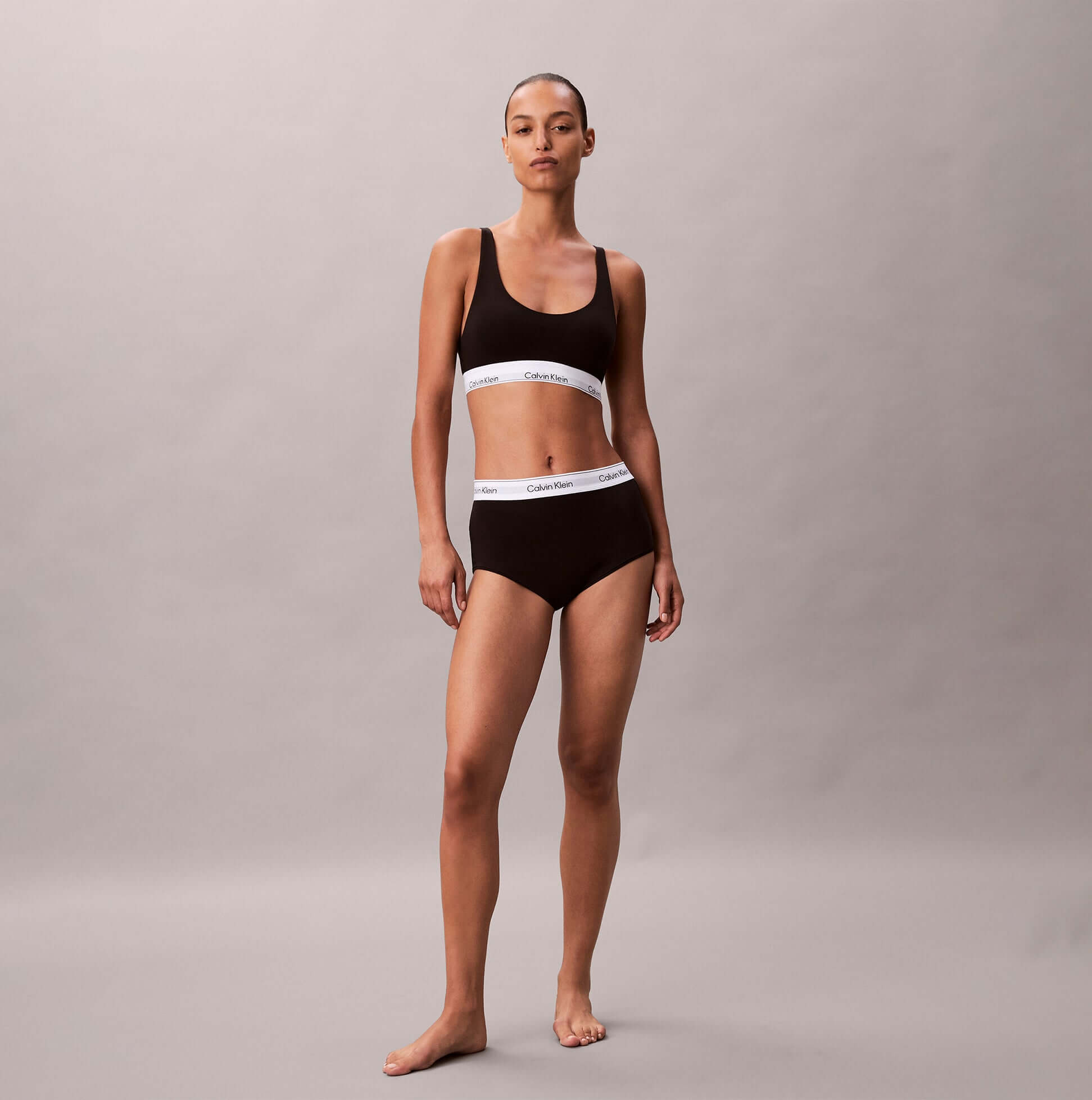 Calvin Klein Icon Cotton Modal Womens Boy Shorts Black, front view, model wearing matching set with white logo elastic band.