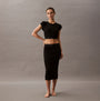 Calvin Klein COTTON STRETCH RIB Womens Crop Top Black front view on model with matching skirt and bare feet.