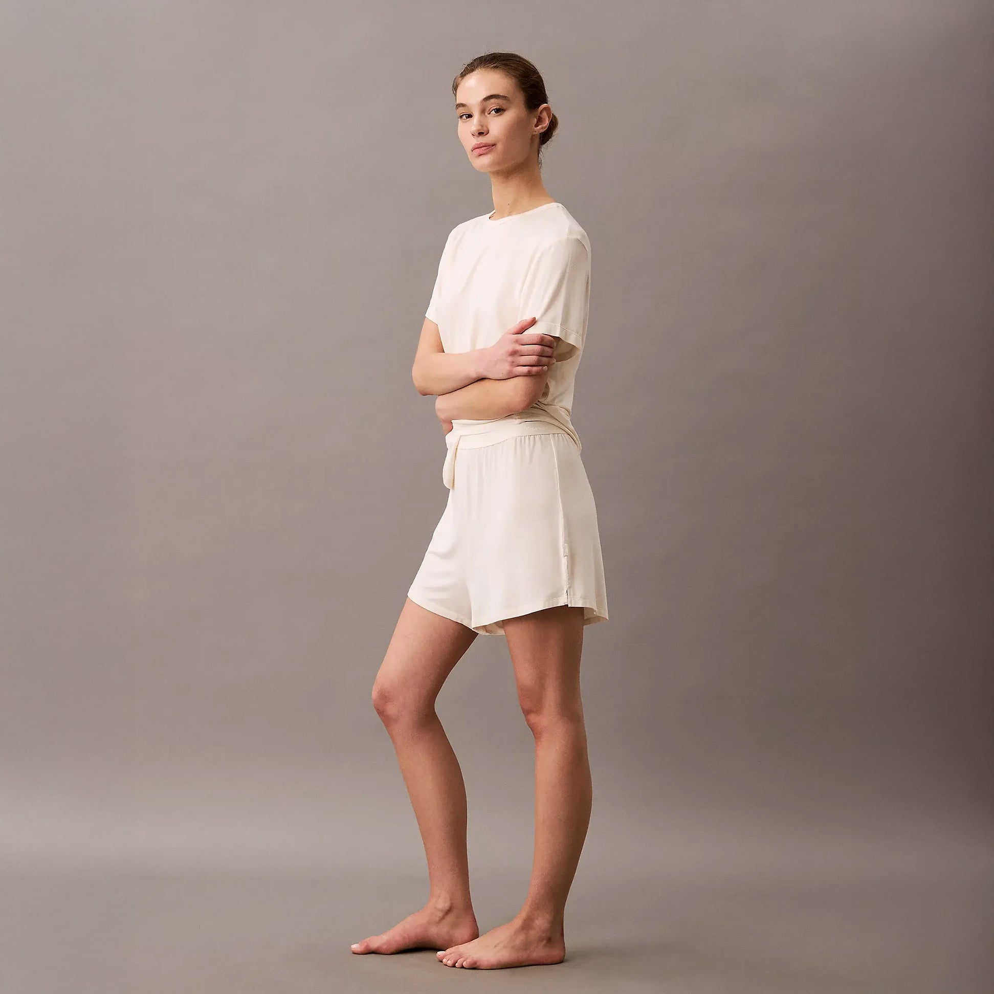 Calvin Klein ULTRA SOFT MODAL Womens Lounge Shorts Ivory side view model wearing comfortable shorts in soft fabric.