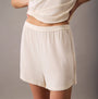 Calvin Klein ULTRA SOFT MODAL Womens Lounge Shorts Ivory side view showcasing soft fabric and elastic waistband.