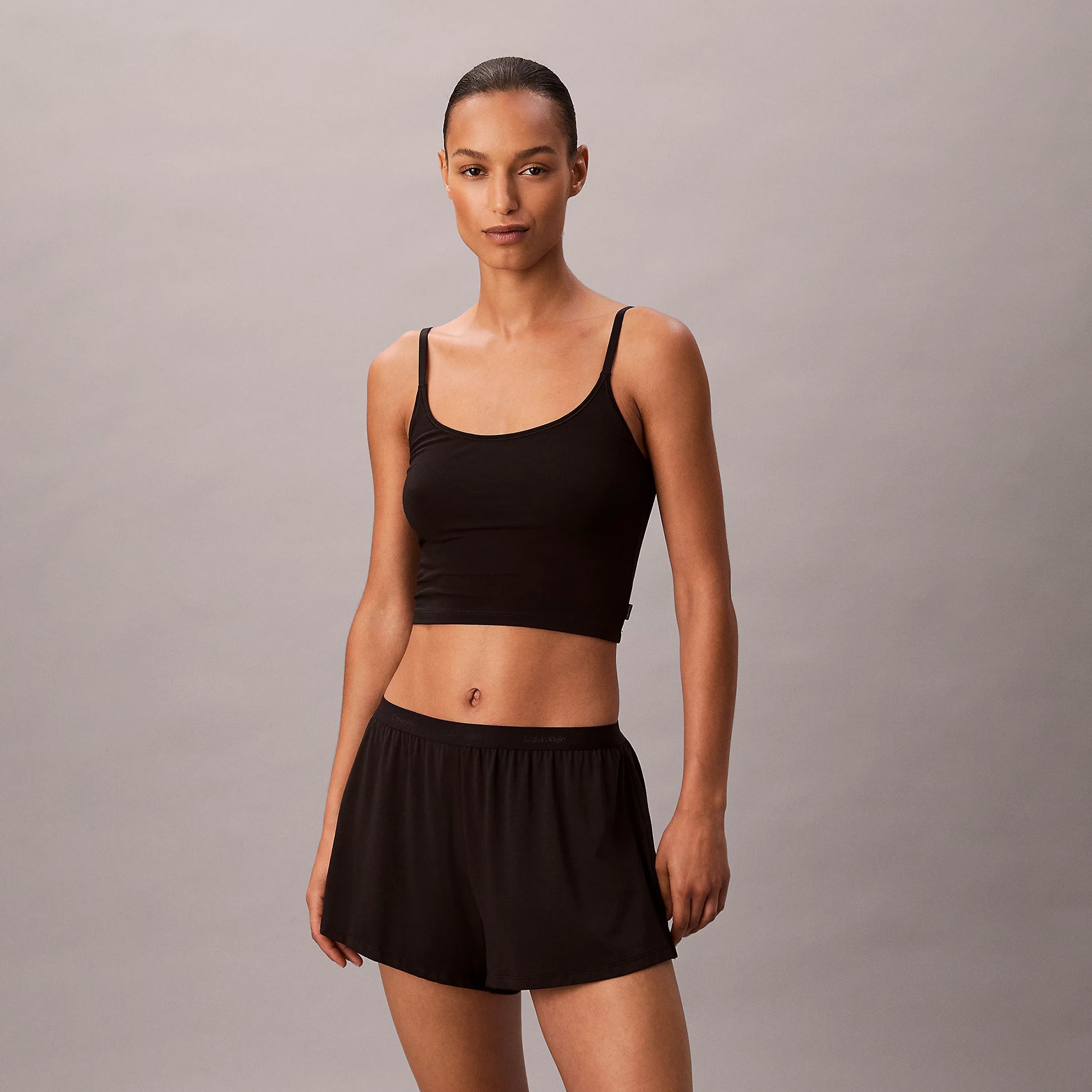 Calvin Klein ULTRA SOFT MODAL Womens Lounge Shorts Black front view model wearing black shorts and matching top.