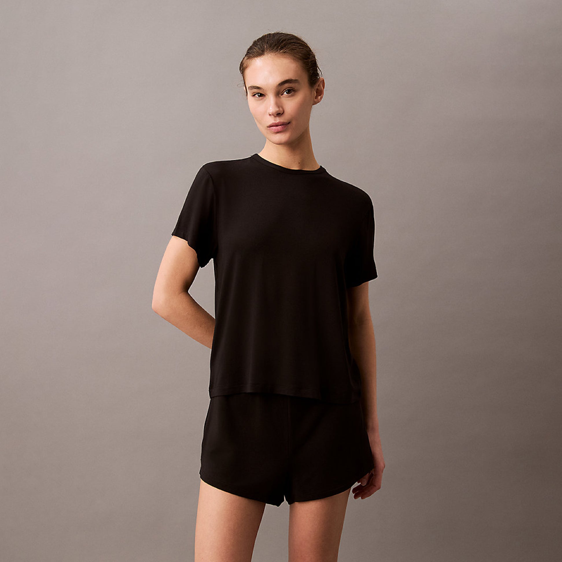 Calvin Klein ULTRA SOFT MODAL Womens Lounge T-Shirt Black, front view, model wearing relaxed fit black t-shirt.