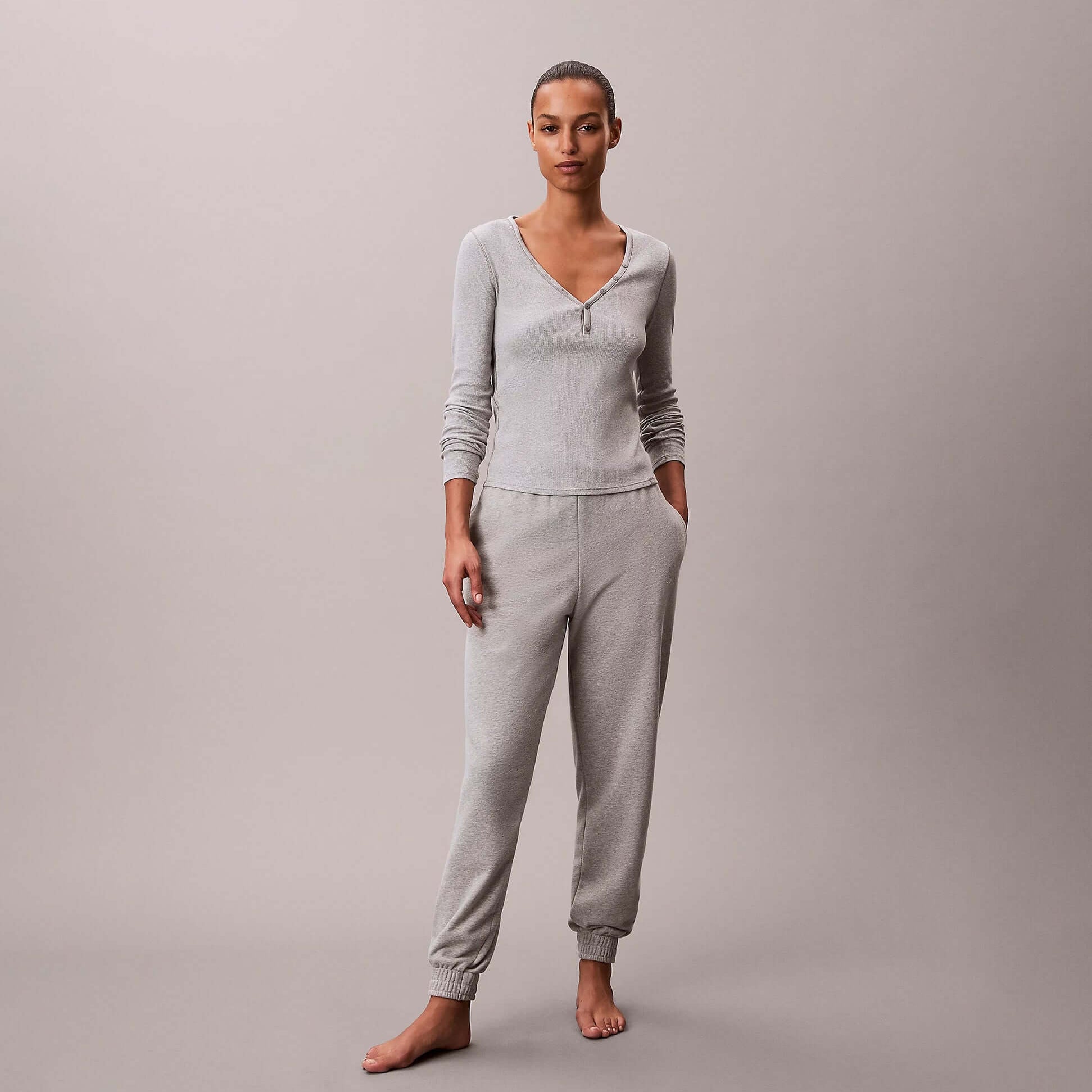 Calvin Klein JOGGER Womens Grey Heather front view, featuring a female model wearing grey joggers and top.