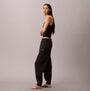 Calvin Klein JOGGER Womens Black side view model wearing joggers on a neutral background.