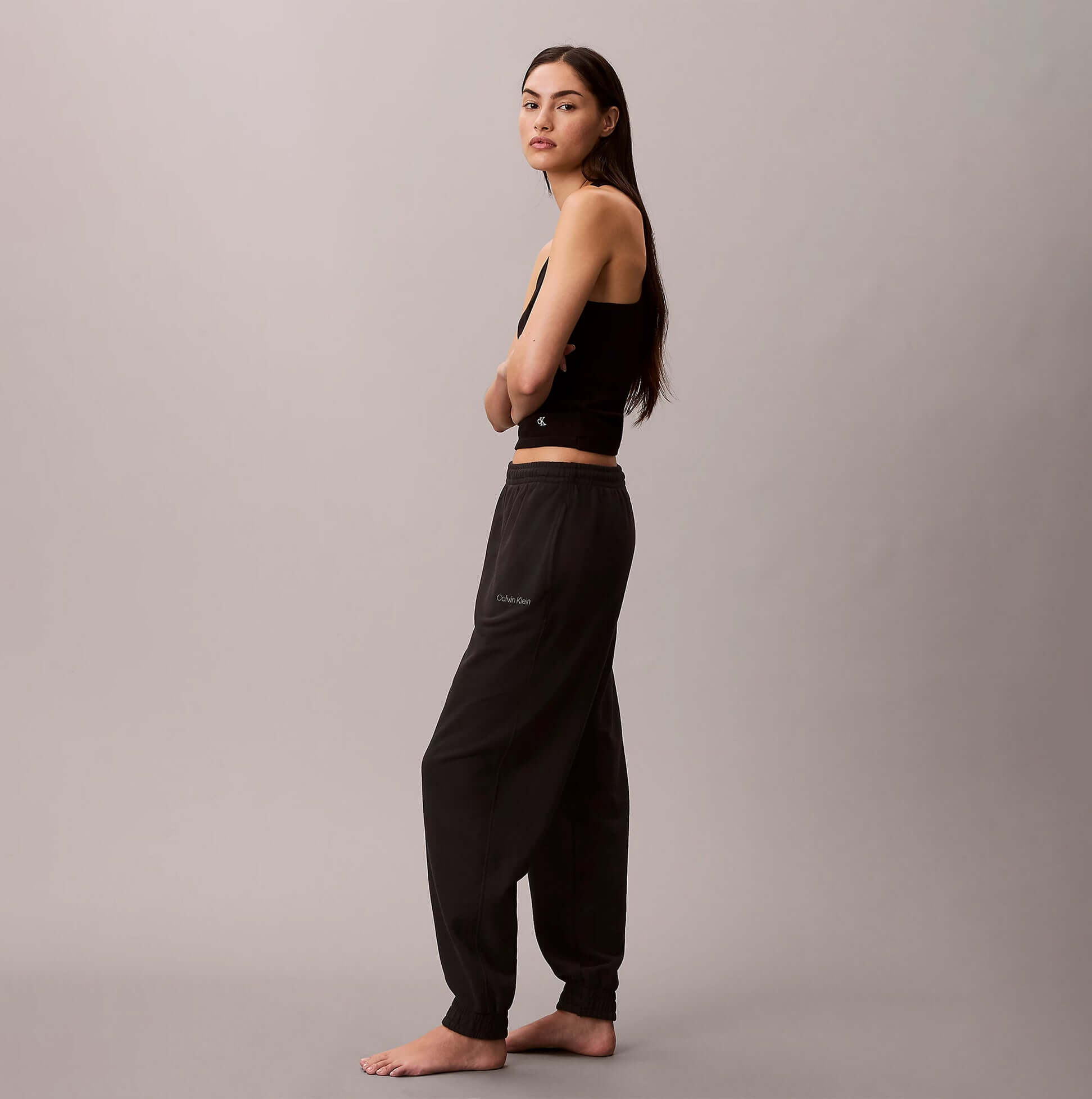 Calvin Klein JOGGER Womens Black side view model wearing joggers on a neutral background.
