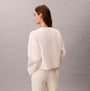 Calvin Klein LS QUILTED SWTSHIRT Womens Sweatshirts Ivory back view on model, showcasing its soft fabric and relaxed fit.