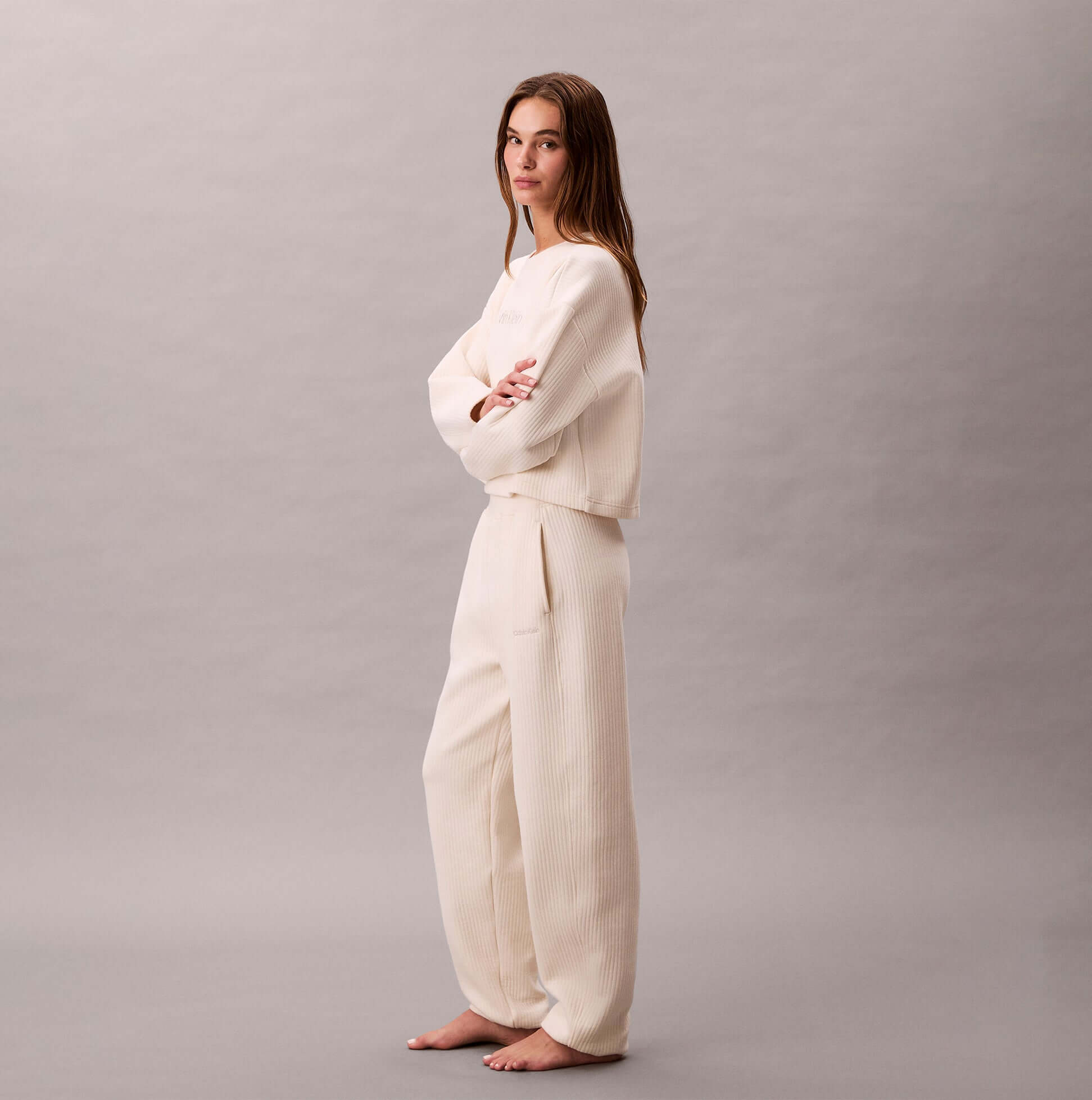 Calvin Klein QUILTED JOGGER Womens Ivory side view model wearing outfit with casual style and relaxed fit.