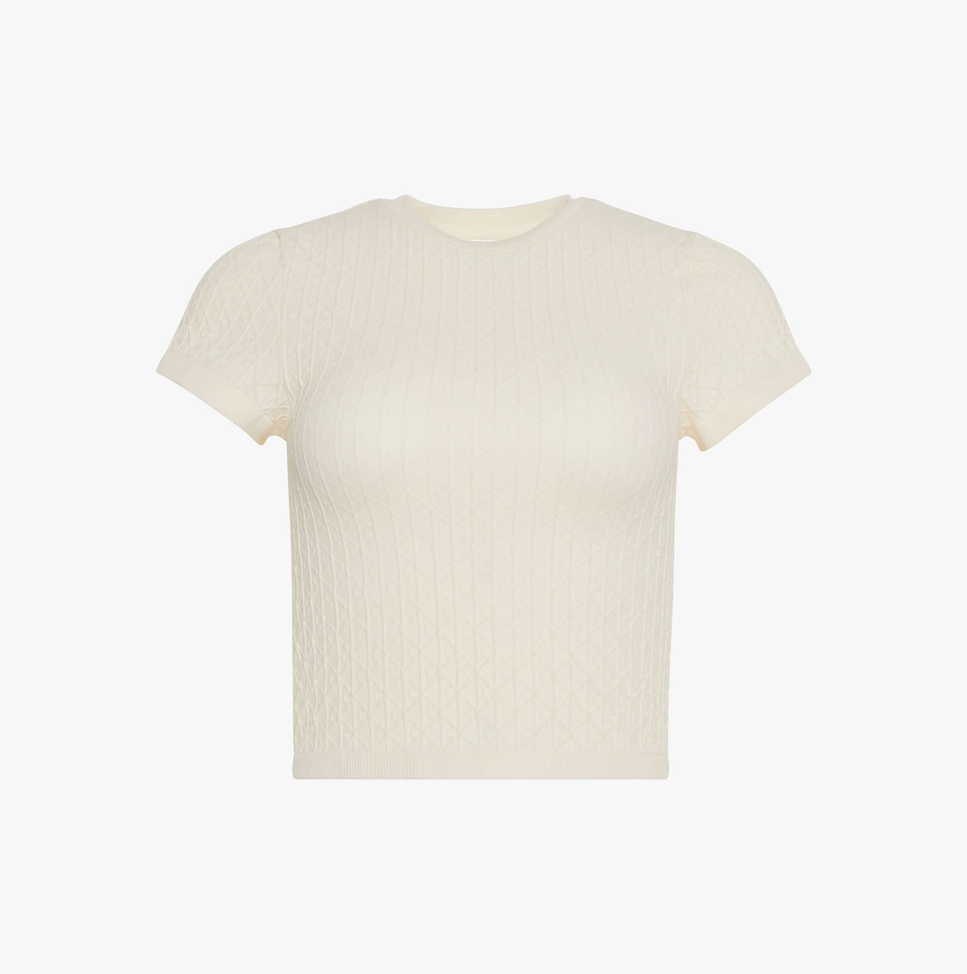 Calvin Klein SEAMLESS TEE Womens Printed CK Knit T-Shirt Ivory front view, short sleeves, textured pattern, stylish design.