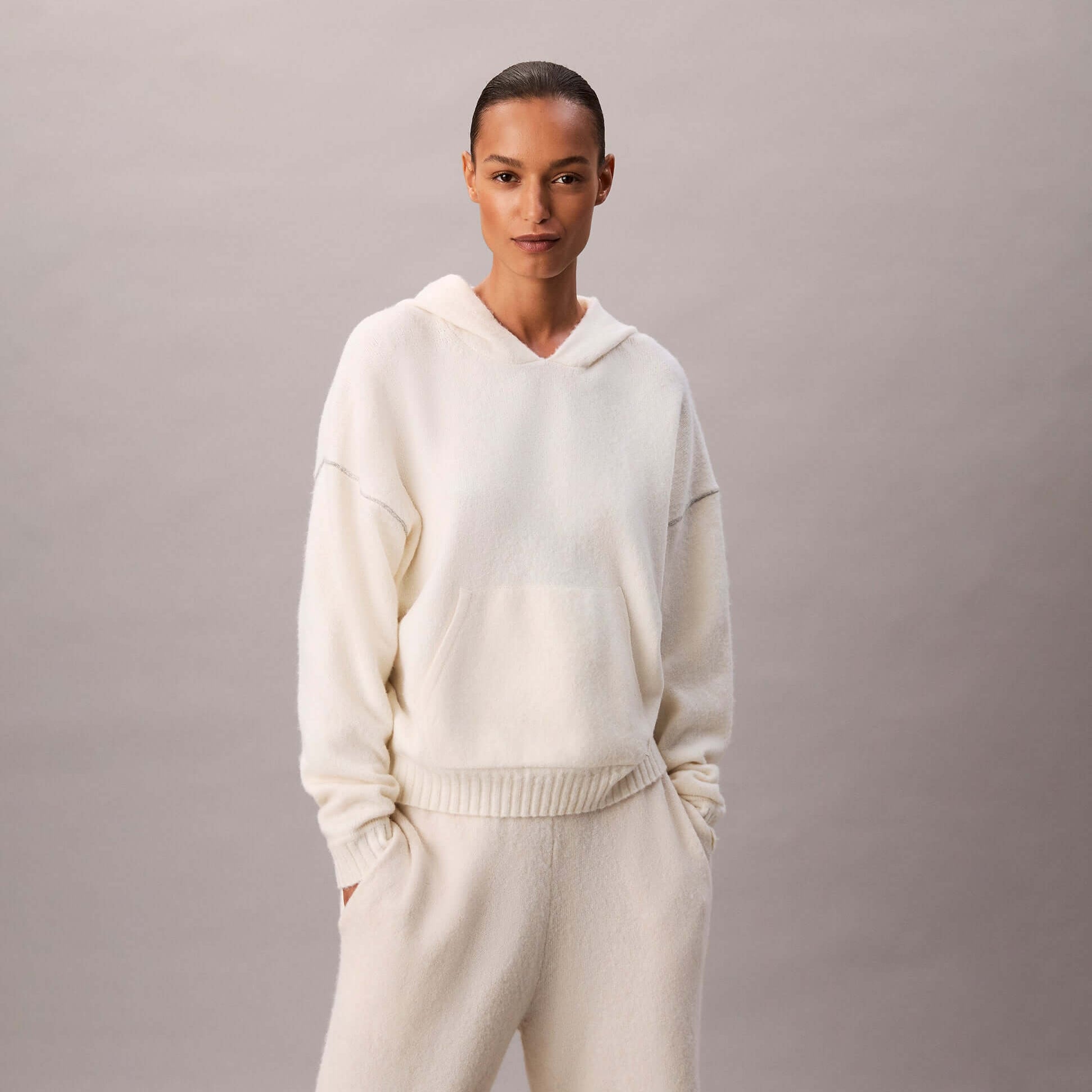 Calvin Klein PLUSH HOODIE. Womens Ivory front view. Stylish warm hoodie made of polyester, elastane, and wool.