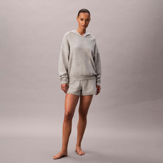 Calvin Klein PLUSH HOODIE. Womens Hoodies Grey Heather front view, styled with matching shorts in a soft blend of grey.