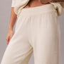 Calvin Klein PLUSH JOGGER. Womens Ivory, front view showing soft fabric and elastic waistband.