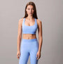 Calvin Klein Womens Quick-Dry Medium Impact Sports Bra Blue front view worn with matching leggings, designed for comfort and style.