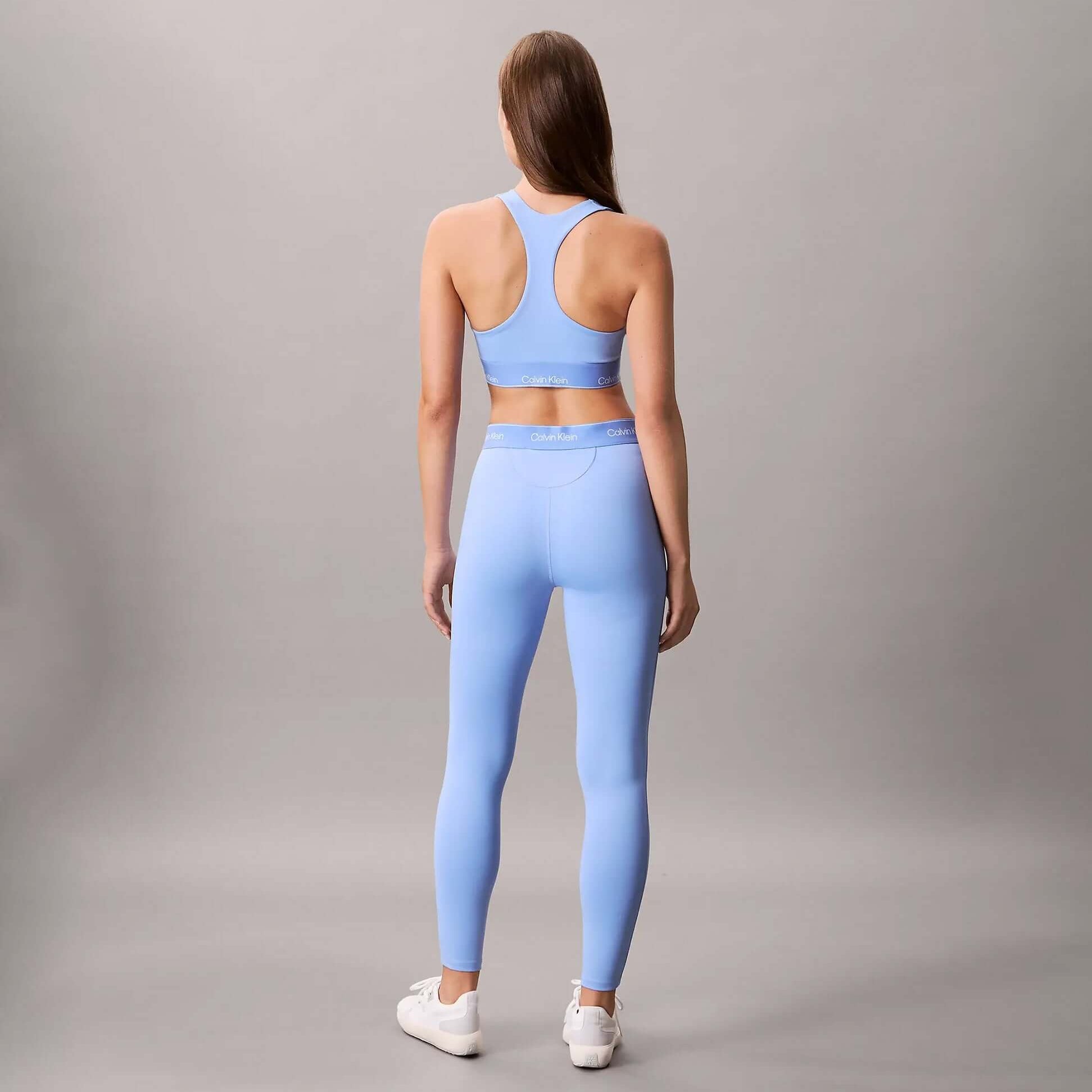Calvin Klein Womens Quick-Dry Medium Impact Sports Bra Blue back view with matching blue leggings.