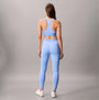 Calvin Klein Womens Quick-Dry Medium Impact Sports Bra Blue back view with matching blue leggings.