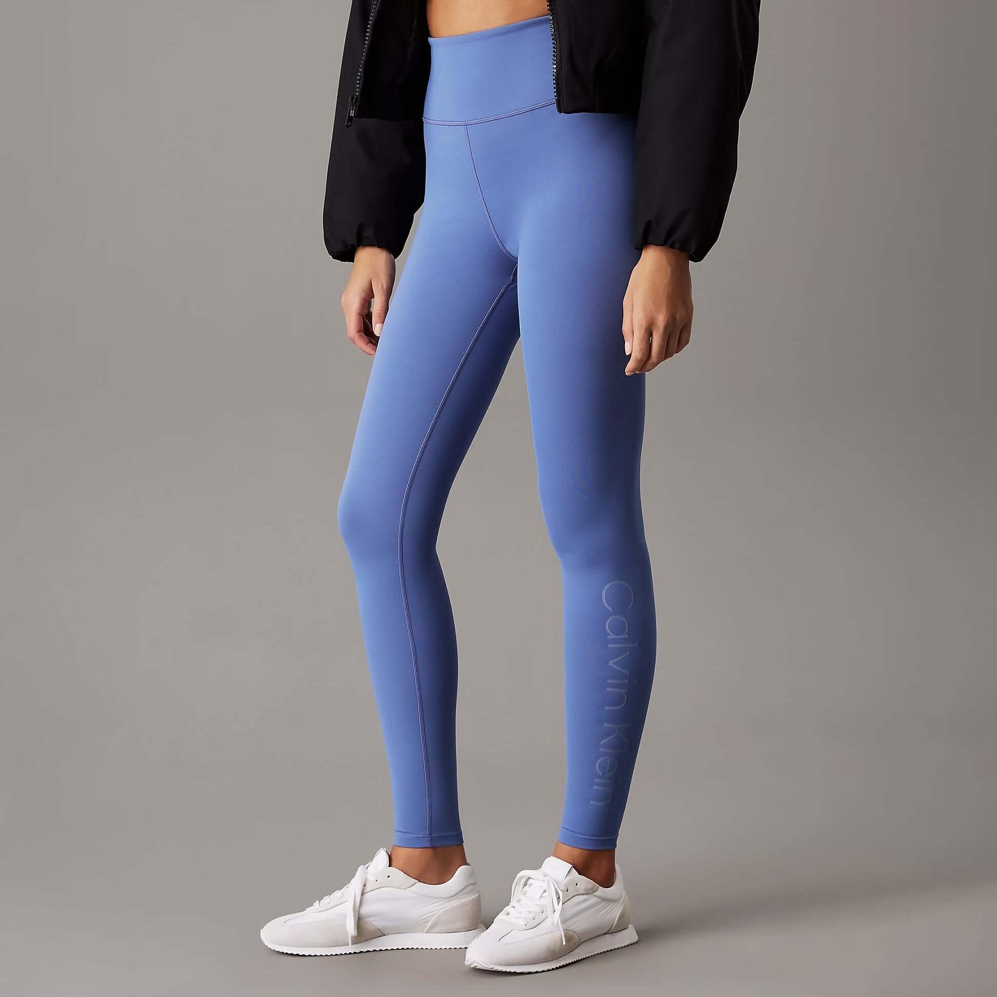 Calvin Klein LEGGING FULL Ladies Full Length Leggings Glacier side view in light blue with white sneakers.
