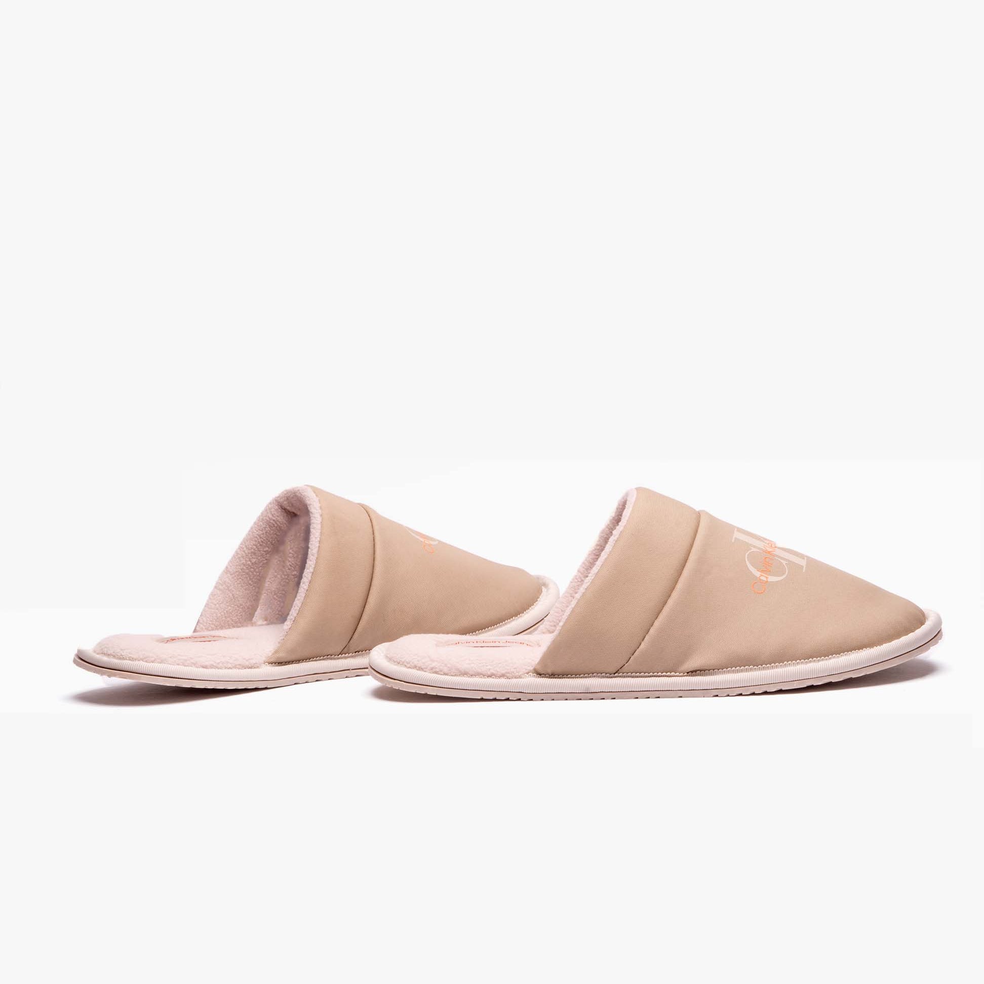 Calvin Klein HOTEL SLIPPER Mens Mules Taupe side view of lightweight slip-on mules with round toe and flat sole.