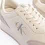 Calvin Klein RETRO RUNNER LOW MIX Mens Trainers Creamy White/Eggshell/Khaki close-up view showcasing logo and lace-up detail.