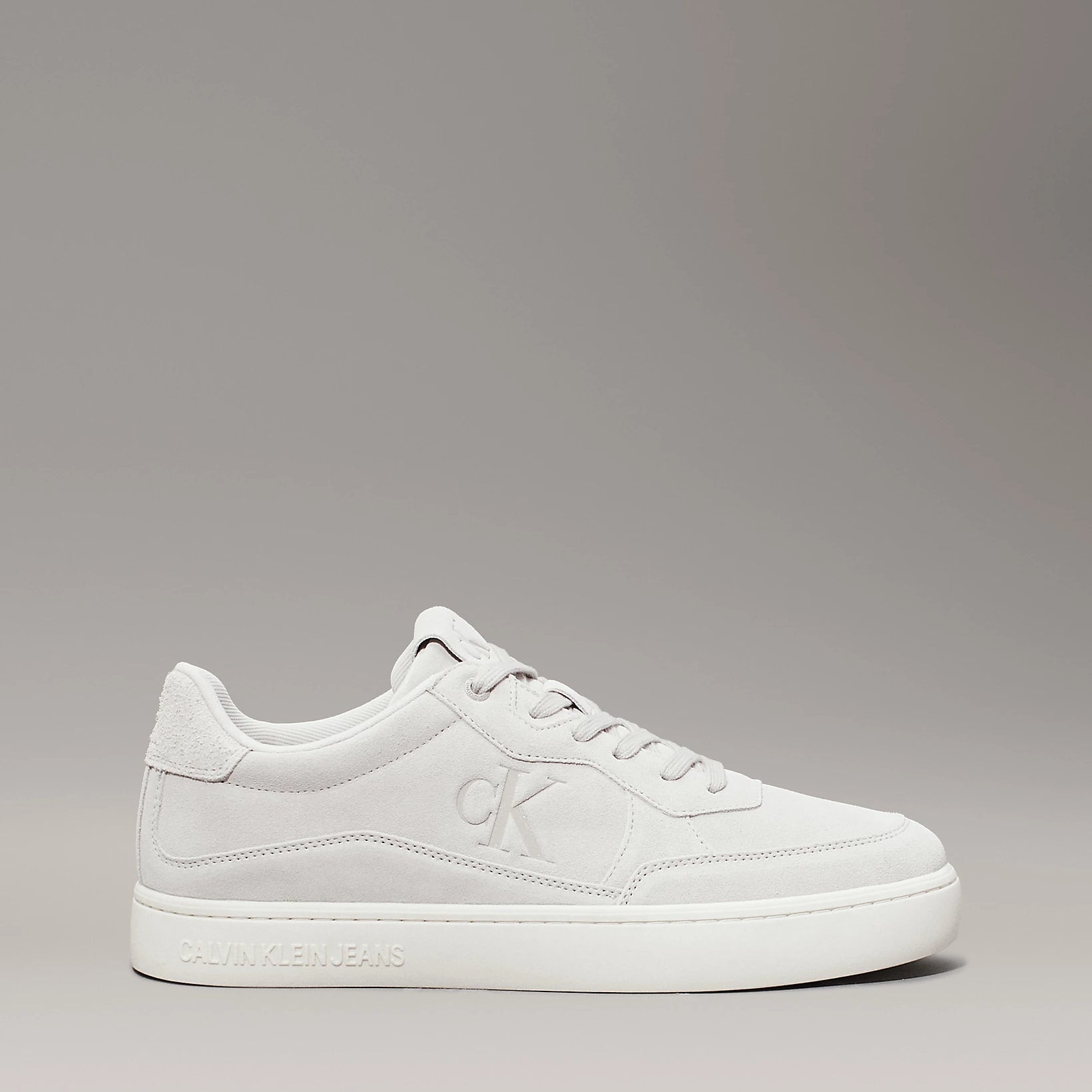 Calvin Klein CLASSIC CUPSOLE ICON Mens Trainers Eggshell/Creamy White side view with nubuck upper and lace-up closure.