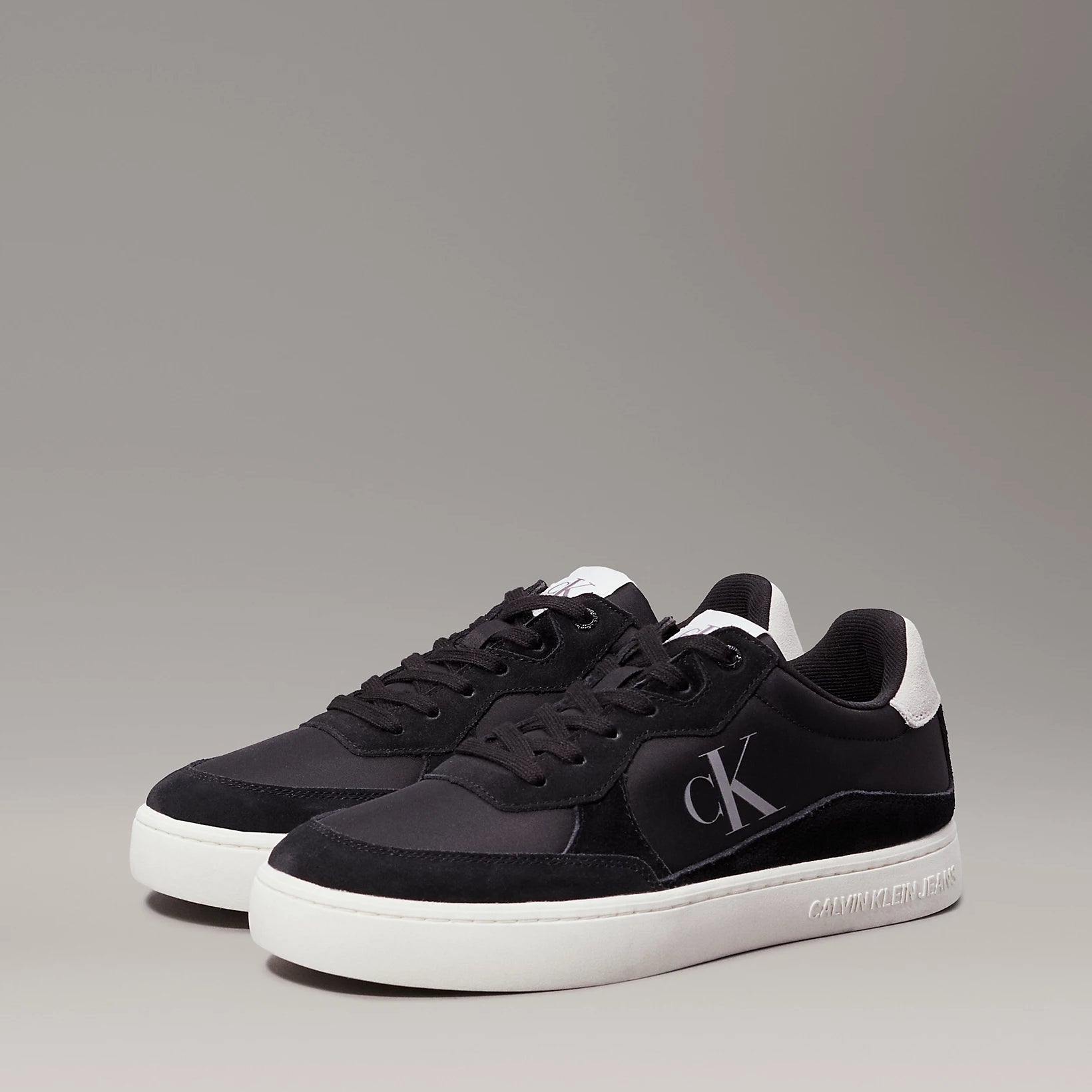 Calvin Klein CLASSIC CUPSOLE ICON Mens Trainers Black/Bright White side view showing lace-up closure and round toe.