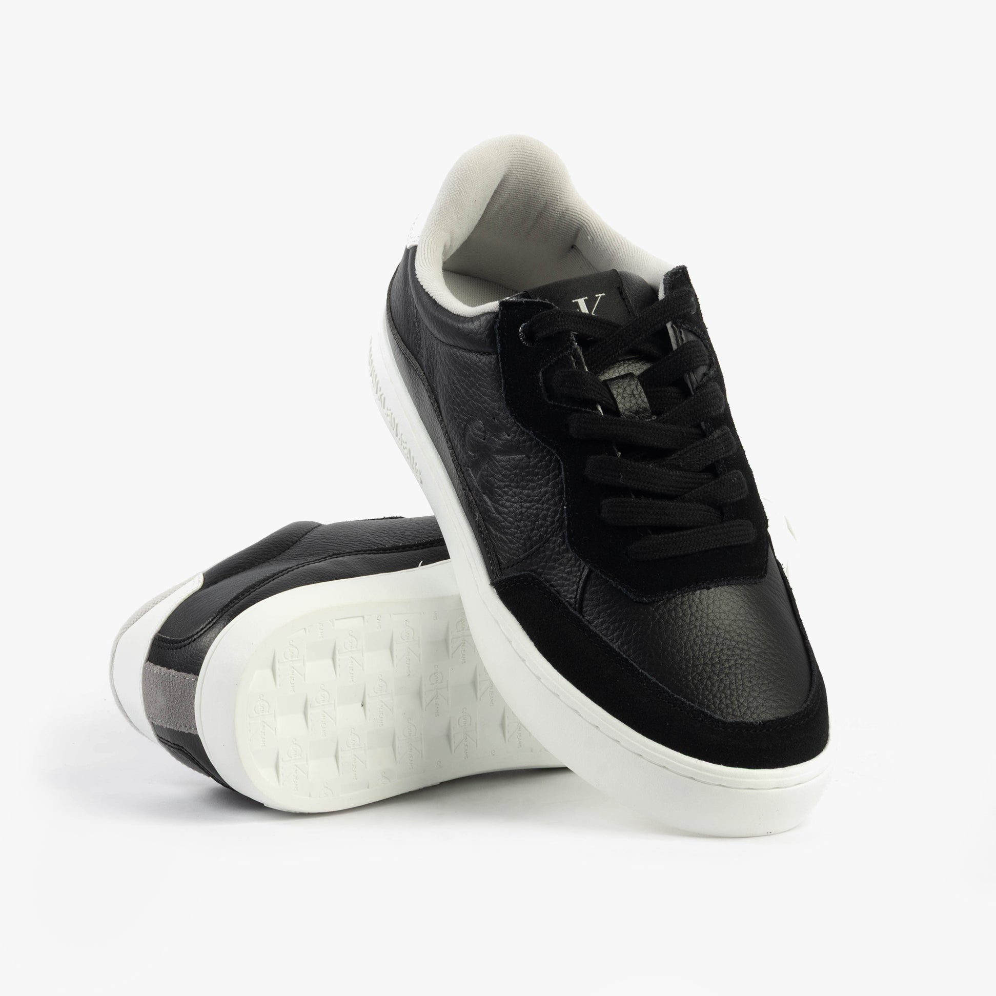 Calvin Klein CLASSIC CUPSOLE Mens Trainers Black/Bright White side view with lace-up fastening and rubber sole on white background.