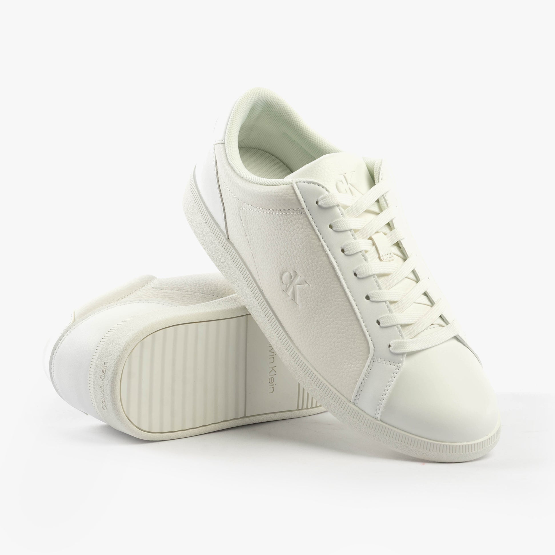 Calvin Klein LOW PROFILE CUPSOLE Mens Trainers Triple Bright White side view showcasing casual leather upper and lace-up closure.
