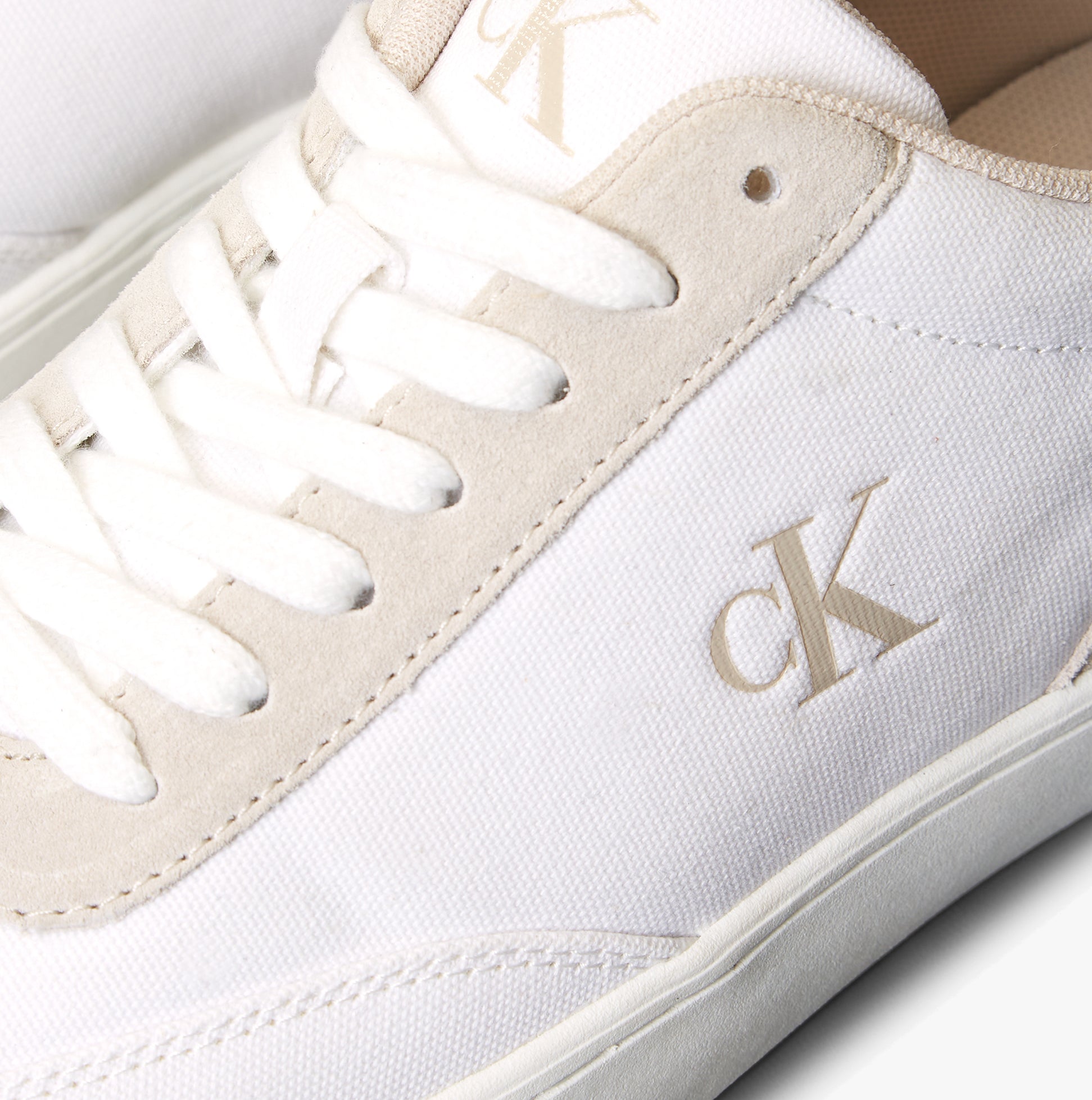 Calvin Klein CLASSIC CANVAS Mens Trainers Bright White/Eggshell detail view with logo and laces.