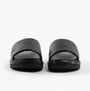 Calvin Klein FLAT MOLDED SLIDE Mens Triple Black front view showcasing sleek leather design and lightweight EVA sole.